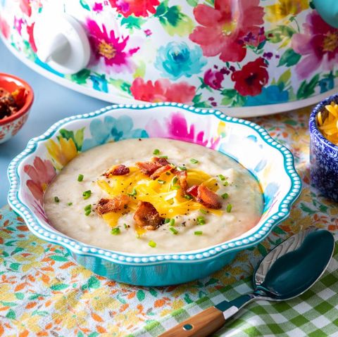 slow cooker potato soup with floral slow cooker in back