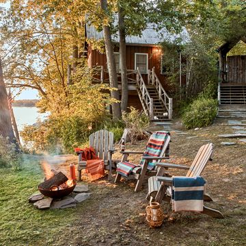 vacation home of vincent mazeau and natasha mazeau in new york’s copake lake exterior with campfire