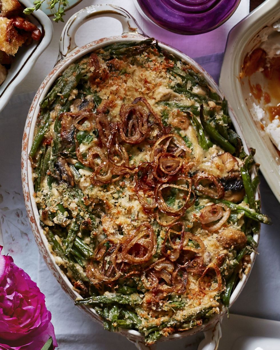 green bean casserole with fried shallots in an oval antique dish
