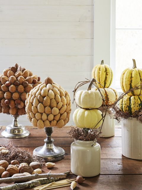 tabletop topiaries made with mini pumpkins and nut covered craft balls