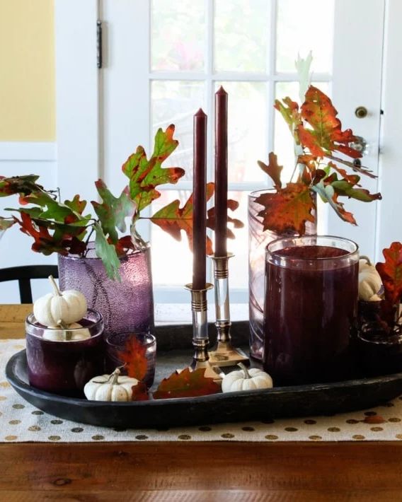 fall centerpieces purple glass and leaves centerpiece
