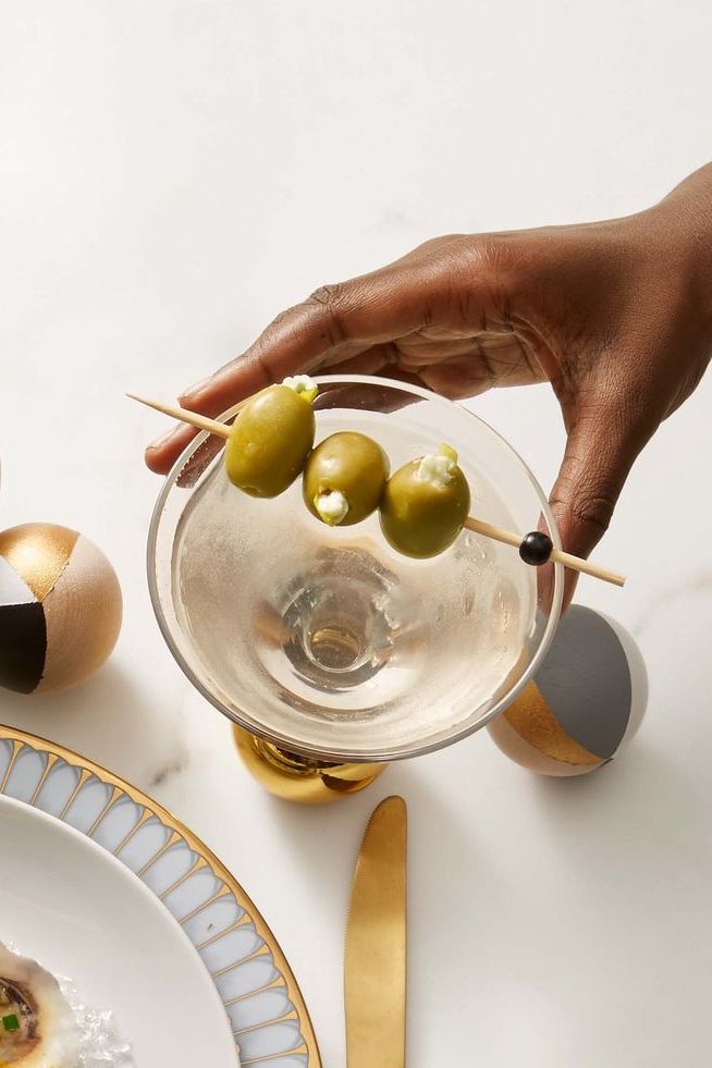 dirty martini with stuffed olives in a cocktail