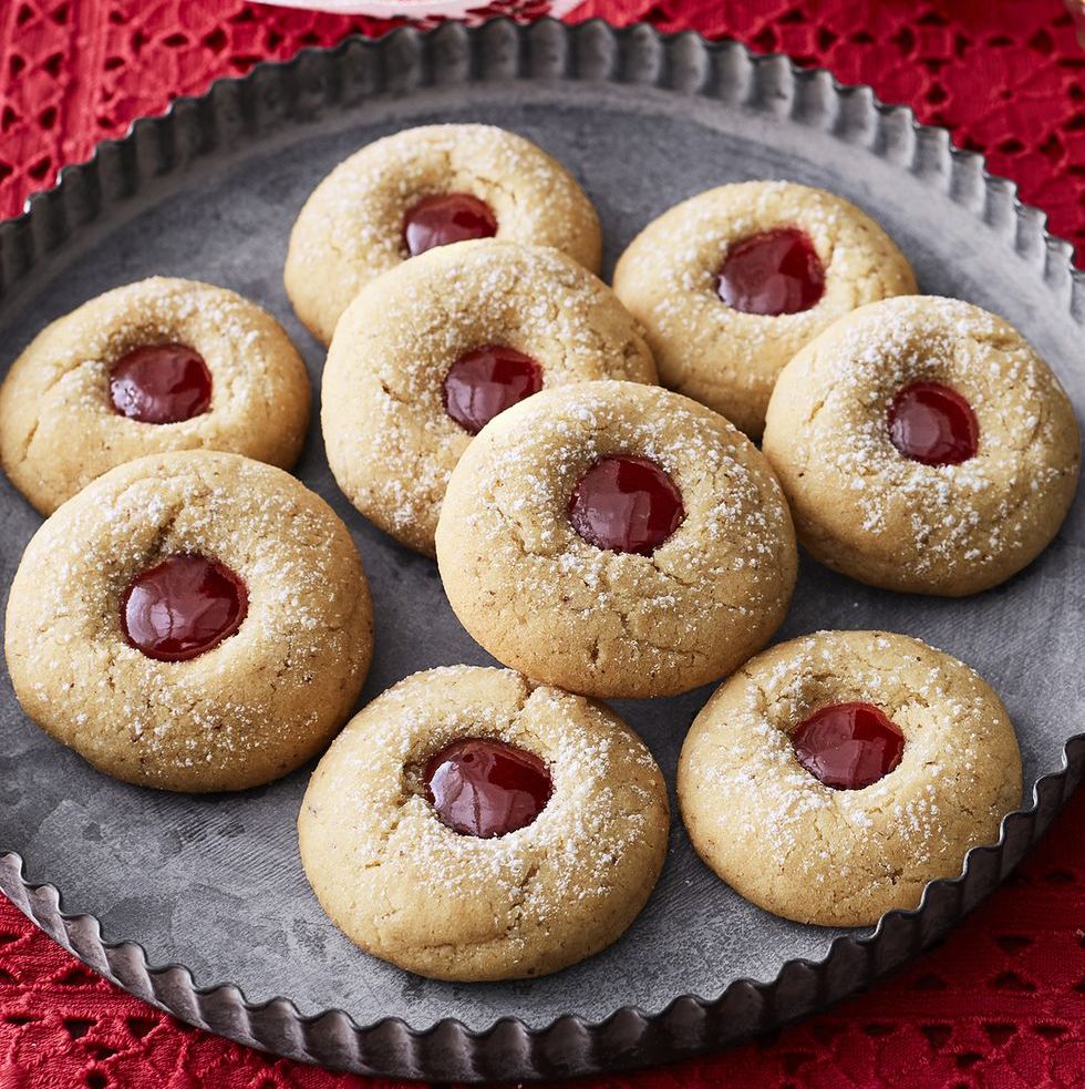 almond raspberry thumbprint cookies on metal tray
