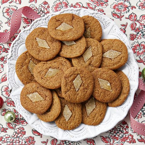 gingerbread slice and bake cookies on white plate with ribbon