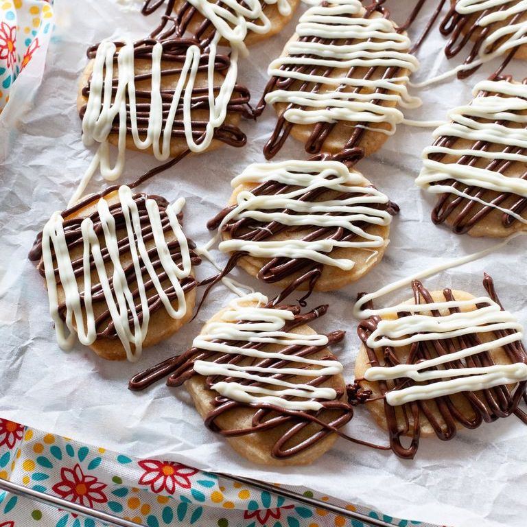 orange shortbread cookies with chocolate and white chocolate drizzle