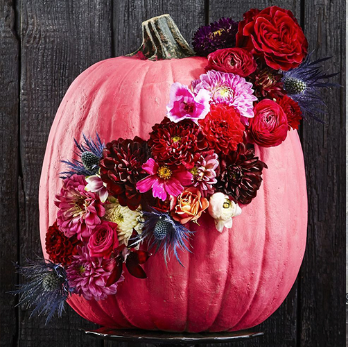fall crafts, pink pumpkin with floral attached, wreath with flowers and paper bats