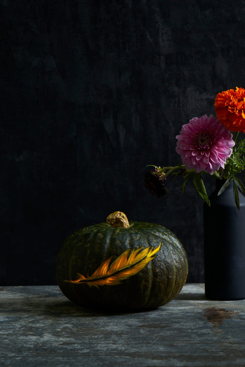 fall crafts pumpkin with a feather design