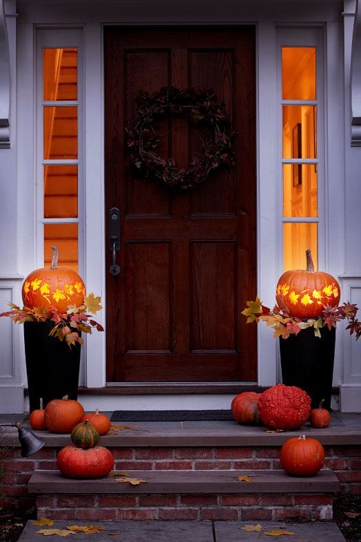 fall crafts leafy lanterns made of pumpkins outside by the front door