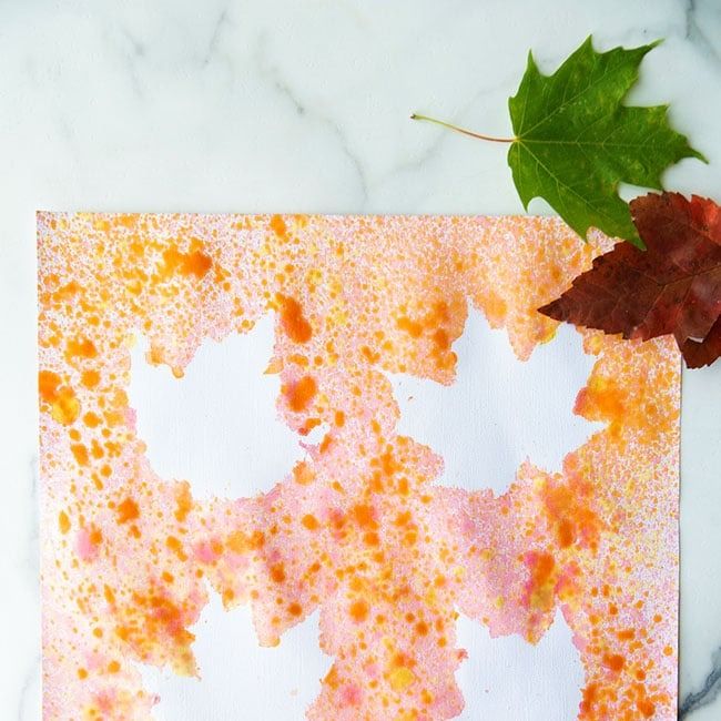 fall crafts for kids, spray painted leaves on paper for art