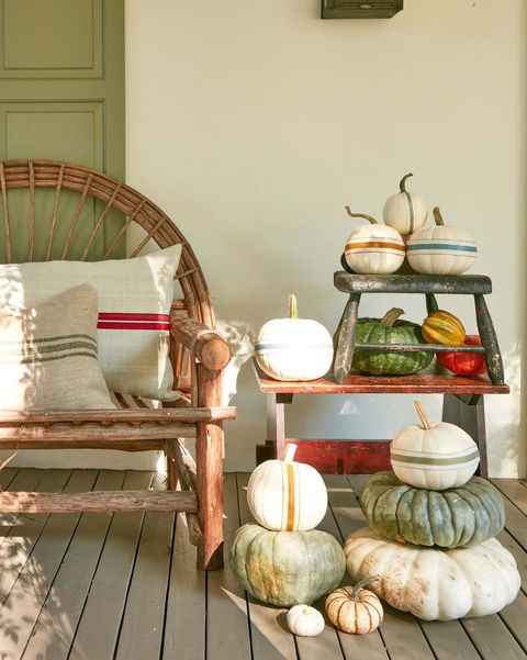 grain sack pumpkins on fall porch