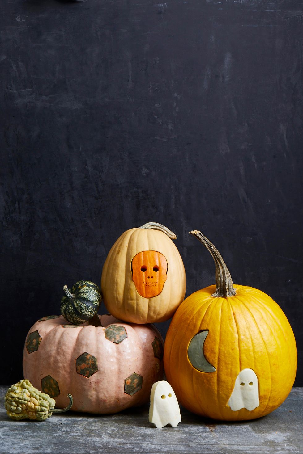 fall crafts, punched pumpkins with ghost and skeleton designs