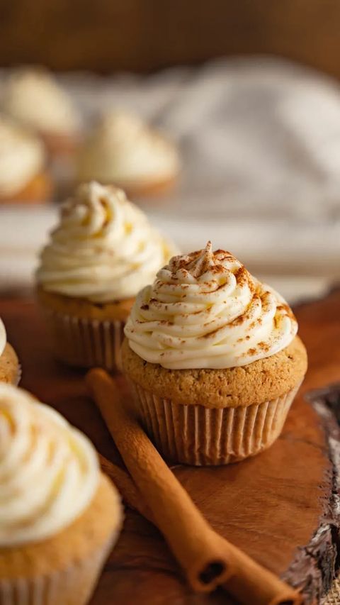 spice cupcakes with cream cheese frosting and cinnamon stick