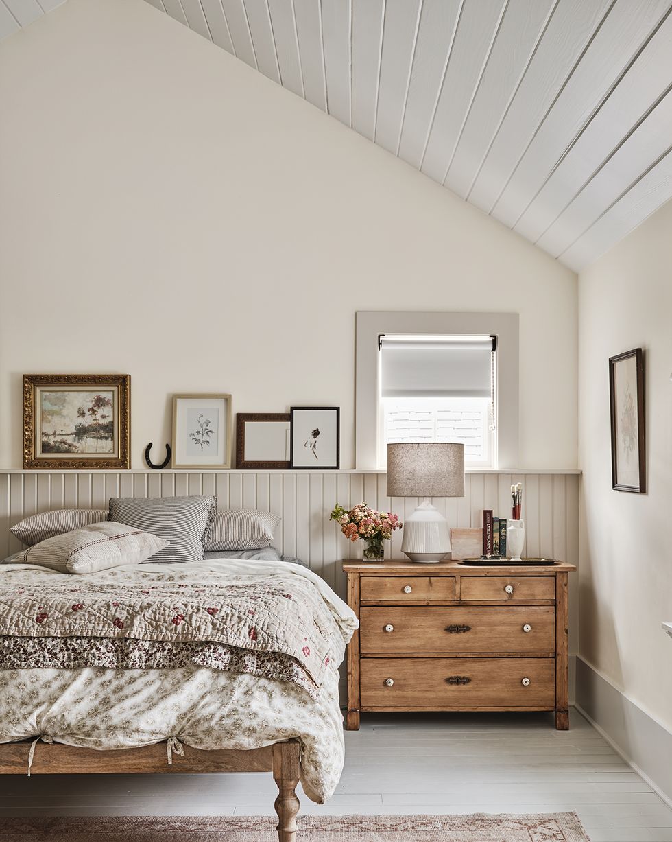 sulphur springs, texas farmhouse home of kk mckenzie and ryan mckenzie bedroom with v groove paneling  neutral colors