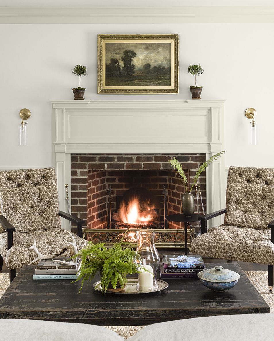colonial revival home designed by lauren liess living room, sitting area, fireplace