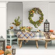 fall decorating ideas back porch with blankets wreath pumpkins arrangements