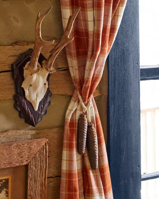 pine cone tassels on a plaid curtain