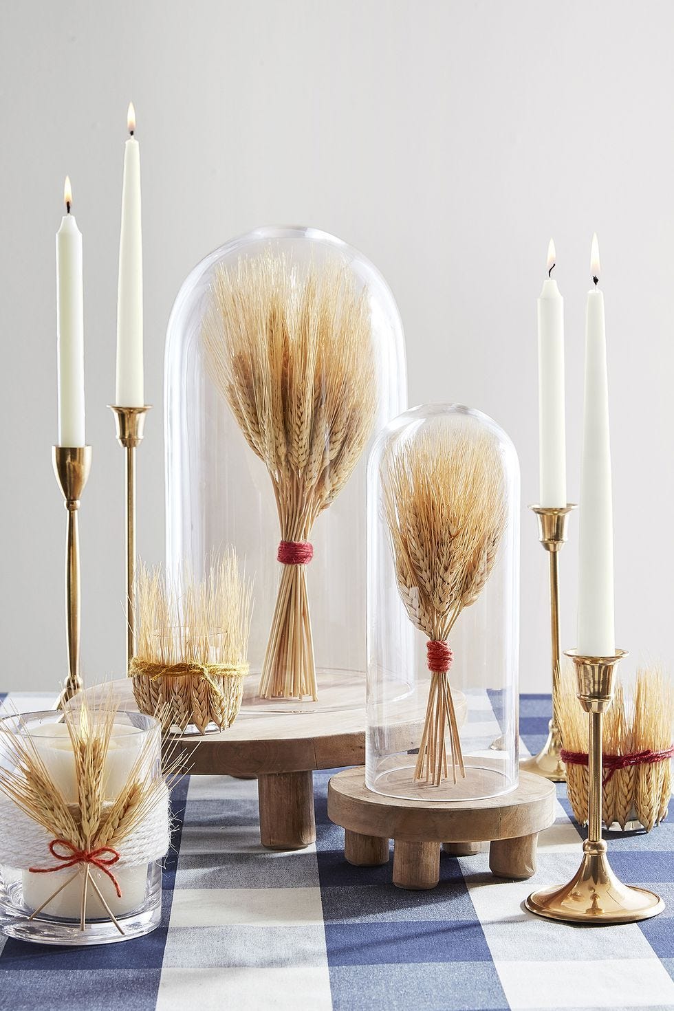 fall decor ideas, wheat cloche on the table in glass displays