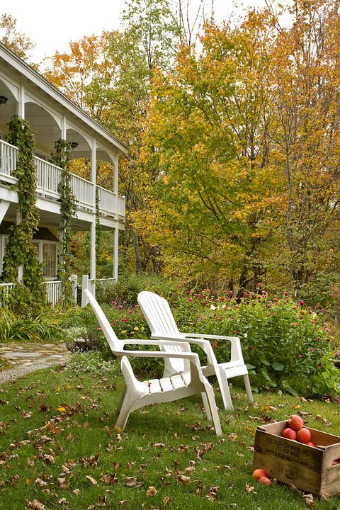 fall exterior vignette of adirondack chairs and apples