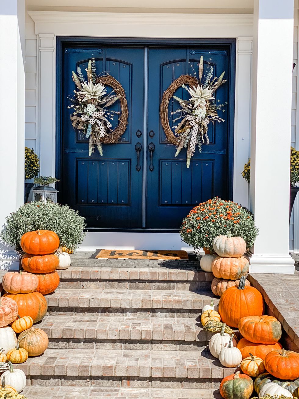 fall front porch with pumpkins and wreaths