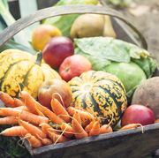 wooden basket full of fresh, organic vegetables