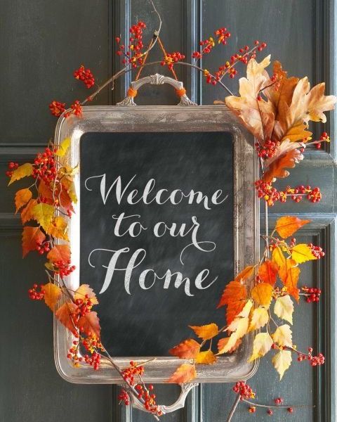 autumnal sign crafted from silver platter with chalkboard center reading welcome to our home, encircled with fall leaves