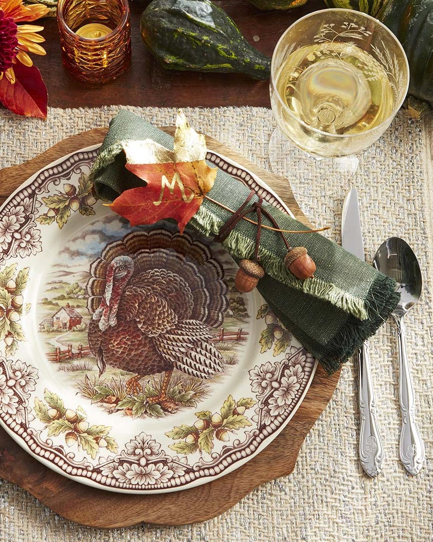 fall leaf place card decorated with gold leaf and an initial written with a gold paint pen