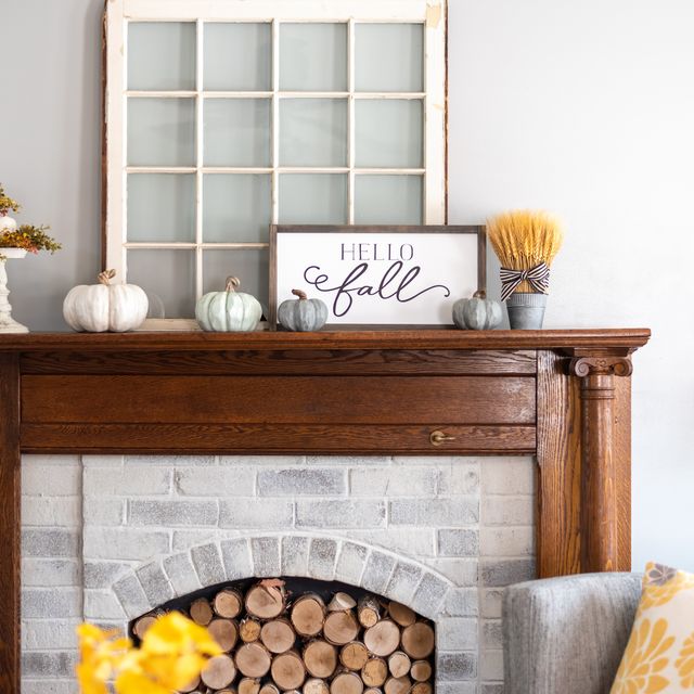 stylish fall decorations on the mantel at home