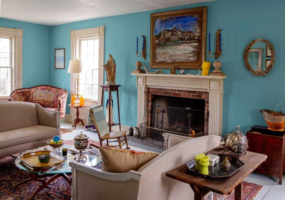 living room with fireplace mantel decorated for fall