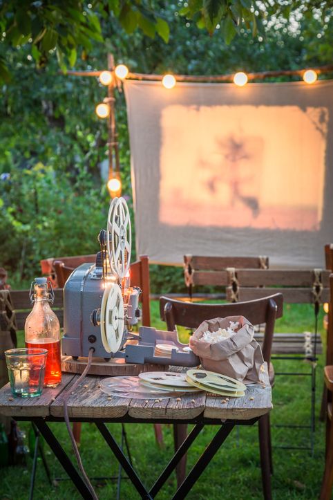 open air cinema with retro projector in the garden