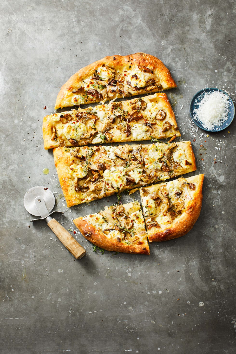 cheesy mushroom pizza sliced into squares
