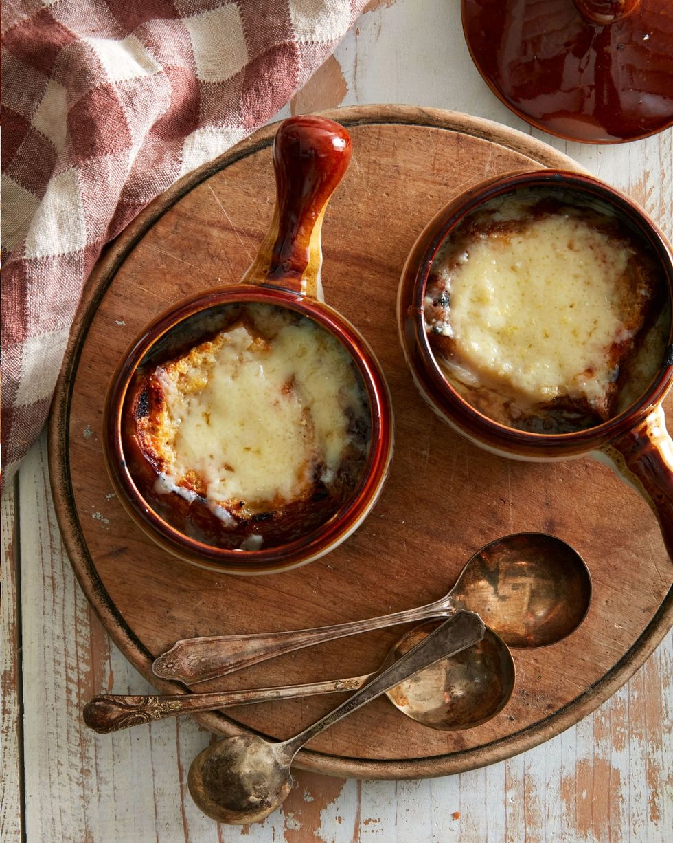 classic french onion soup in two brown soup crocks