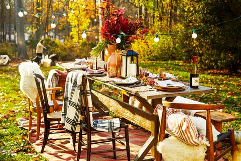 outdoor dining table decorated for fall