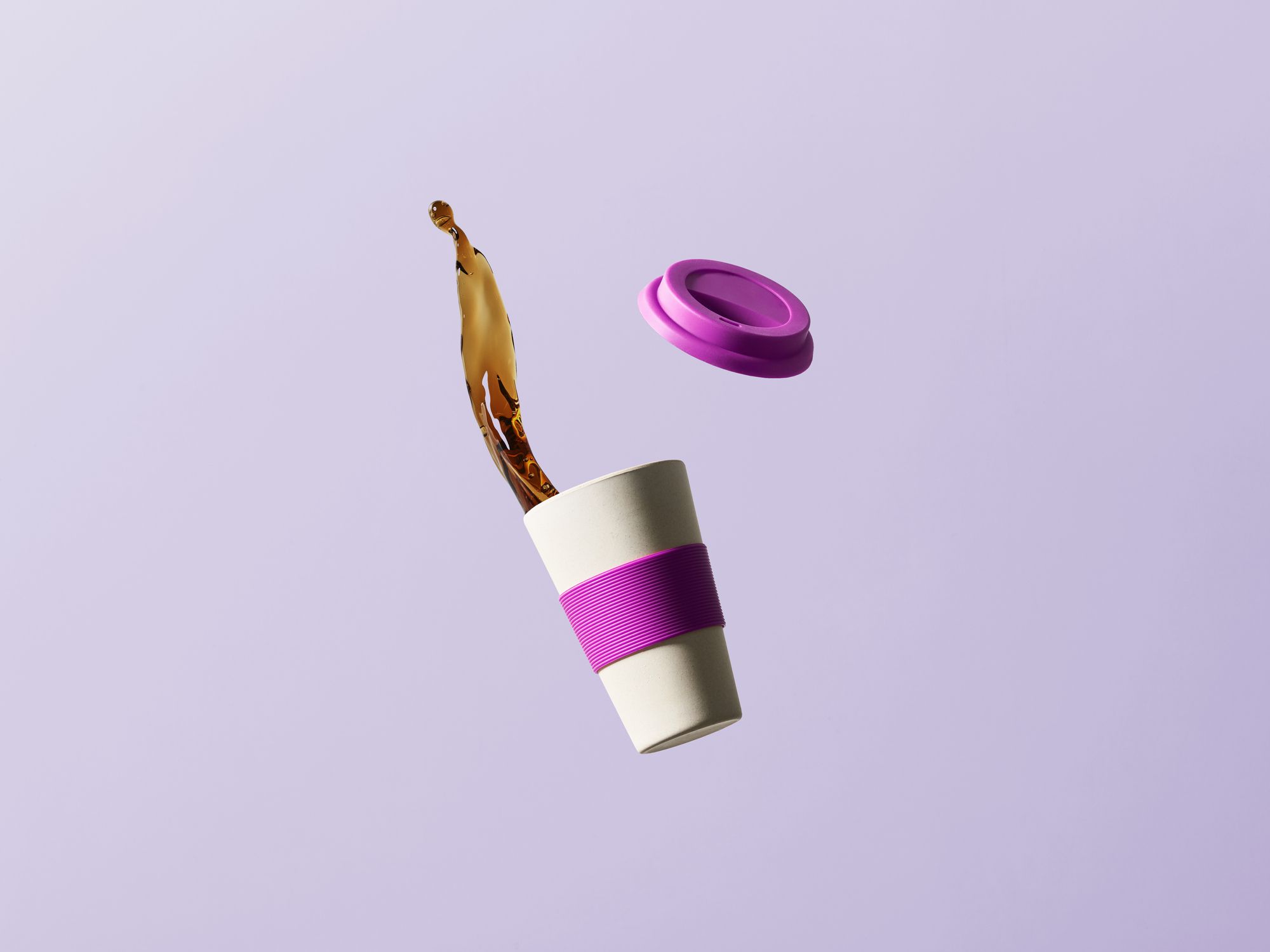 falling reusable coffee cup on a purple background