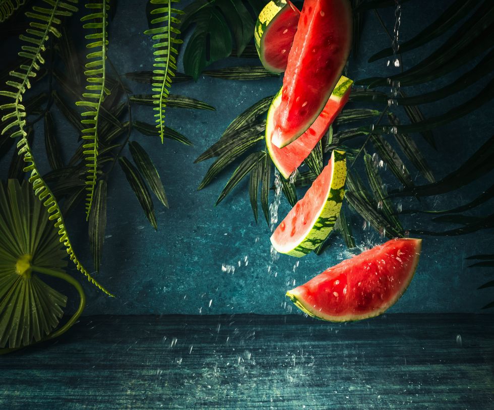 falling watermelon pieces with water splash