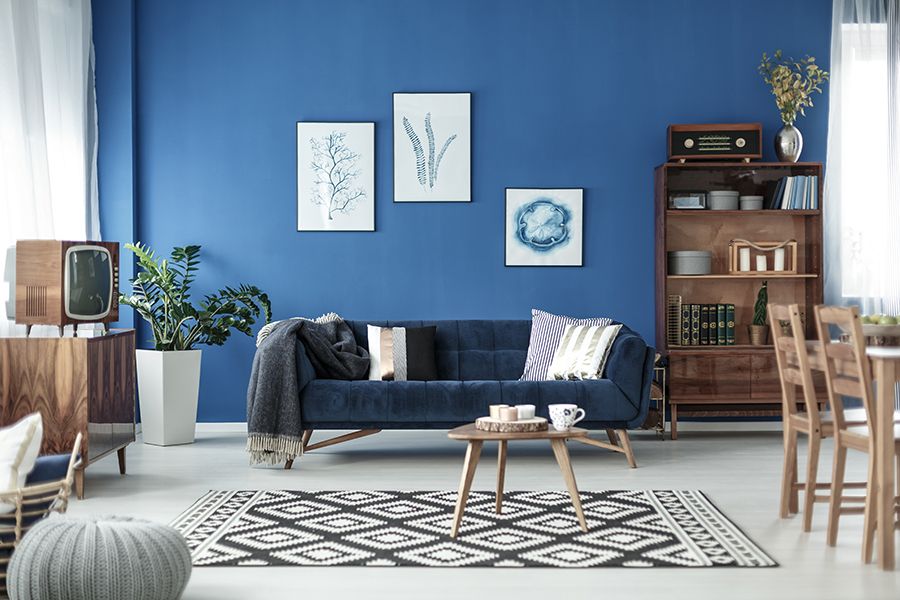 Blue, Living room, Furniture, Room, Interior design, Couch, Property, Wall, Table, Coffee table, 