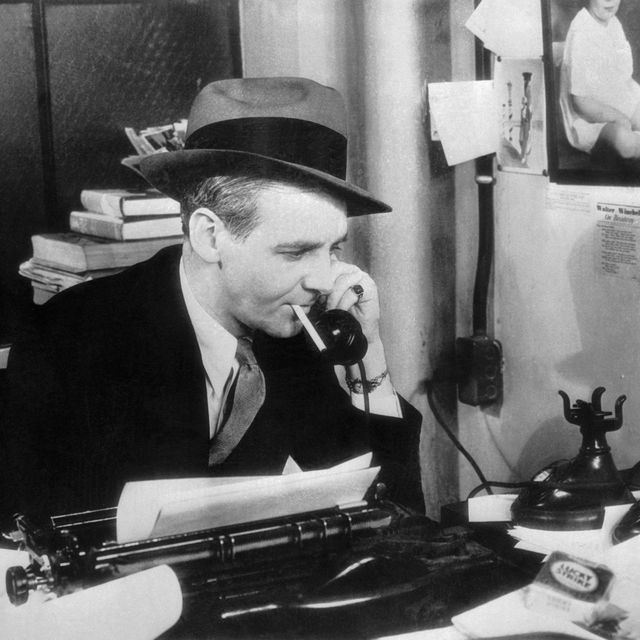 Walter Winchell Talking on Telephone in His Office