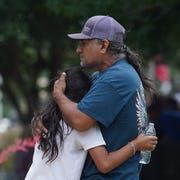 US-SCHOOL-CRIME-TEXAS man and little girl hugging in the wake of uvalde shooting