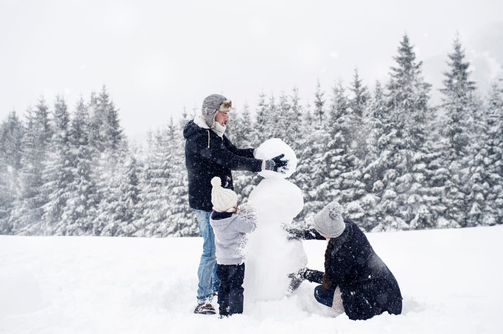 family building snowman together