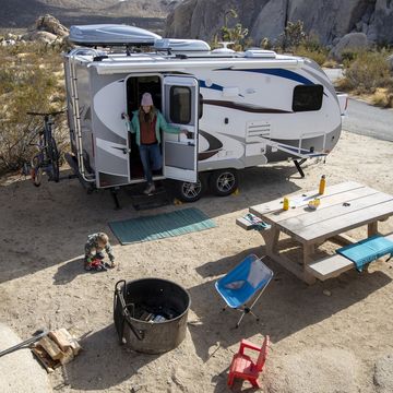 a family camping in a tralier in joshua tree