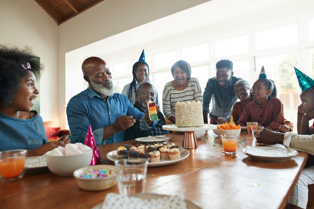 family celebrating birthday at home