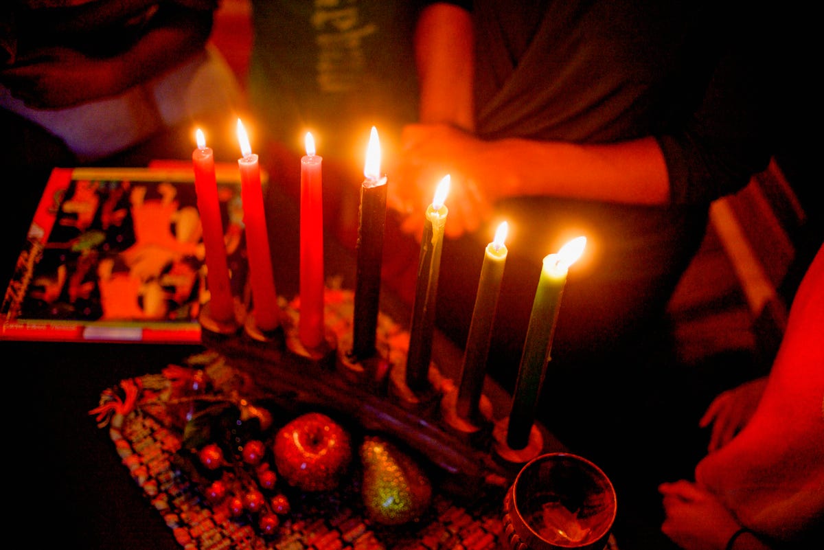 family celebrating kwanzaa, elevated view