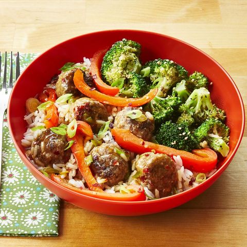 ginger meatballs with sesame broccoli in red bowl over rice