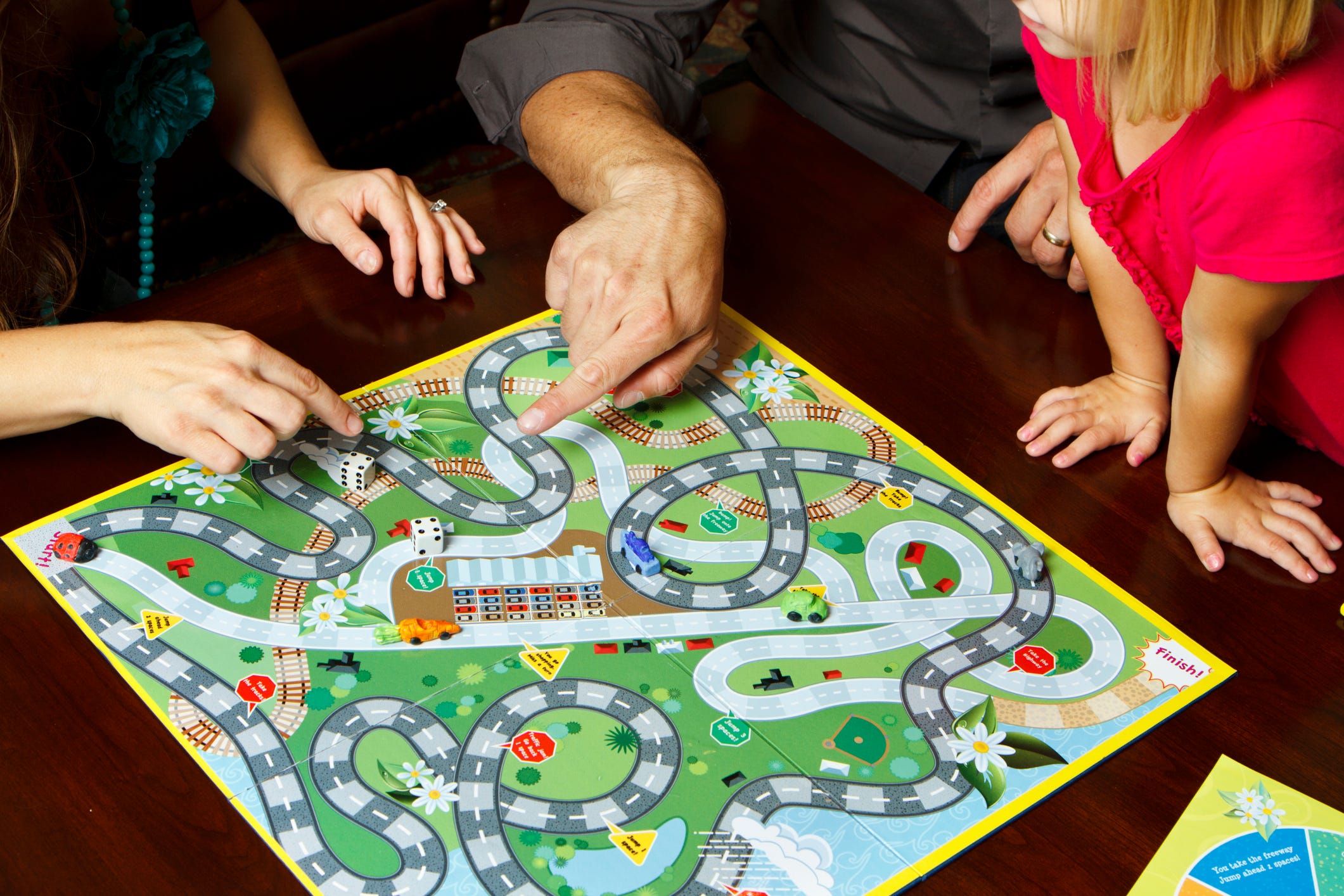 family playing board game
