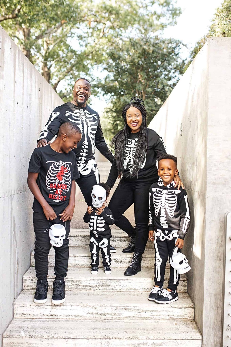 Family dressed in skeleton costumes