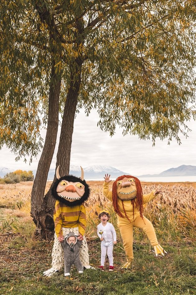 a family in a where the wild things are family halloween costume featuring two adult wild things, max and a baby wild thing