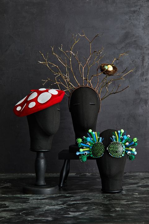 a trio of family halloween costume accessories incuding a mushroom cap, a hat with branches and bug eyes