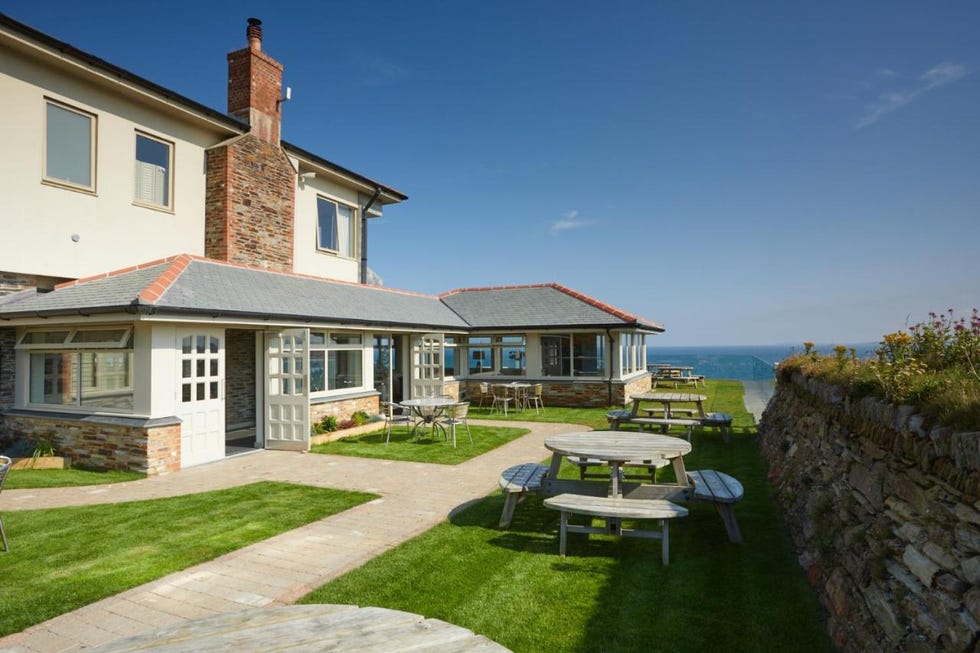 a house with a patio and tables