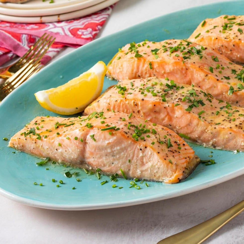 a plate of fish and lemon