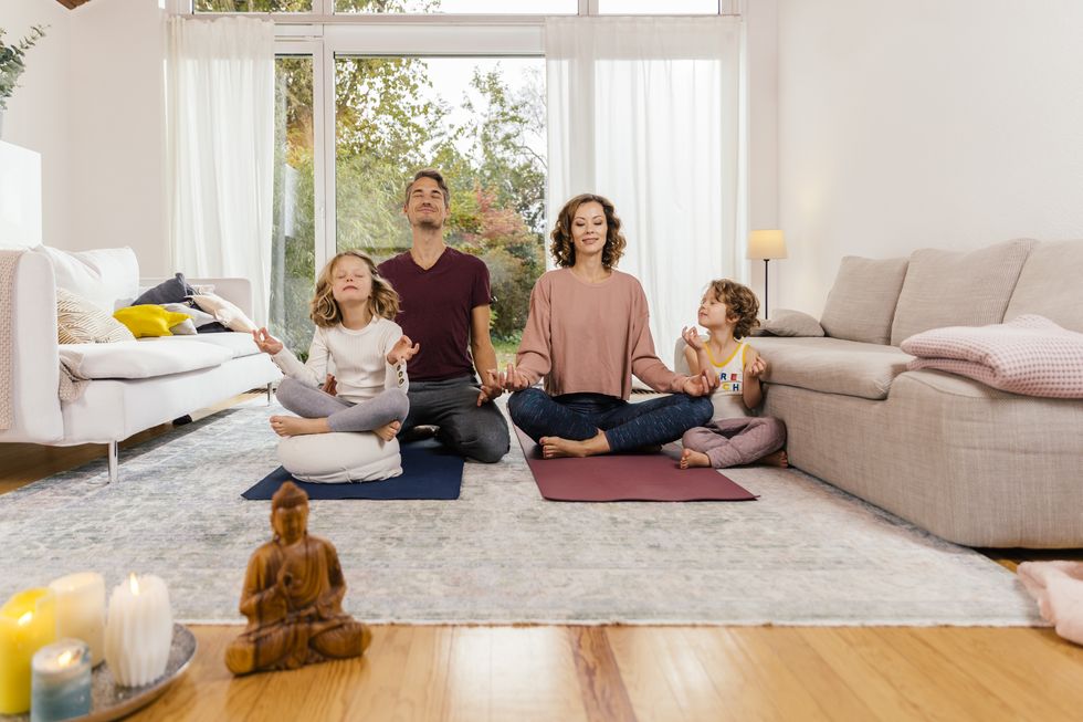 family meditating together at home