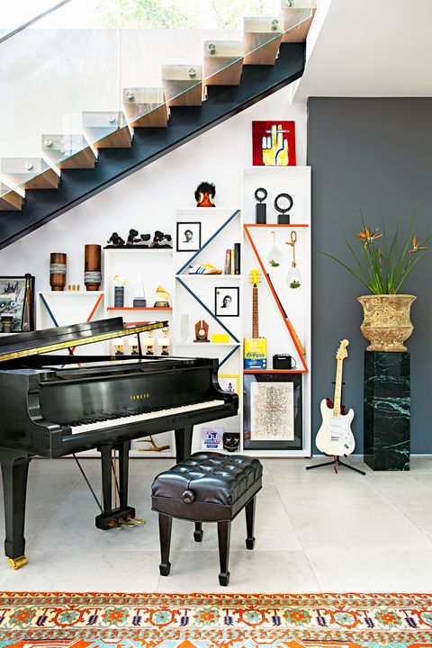 modern family room with piano and guitar